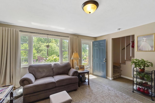 2004 Old Tusculum Rd, Greeneville, TN 37745 - carpeted living room with stairs, baseboards, and plenty of natural light