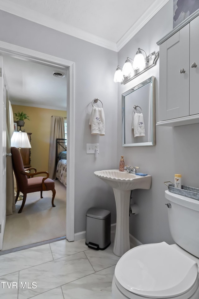 2004 Old Tusculum Rd, Greeneville, TN 37745 - ensuite bathroom featuring crown molding, visible vents, marble finish floor, toilet, and ensuite bath
