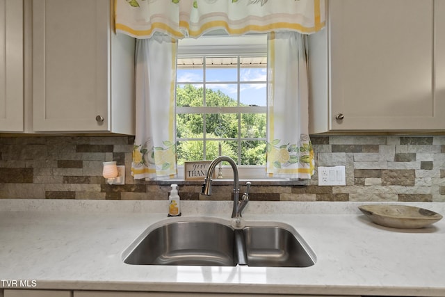 2004 Old Tusculum Rd, Greeneville, TN 37745 - kitchen with a sink, light stone counters, and tasteful backsplash
