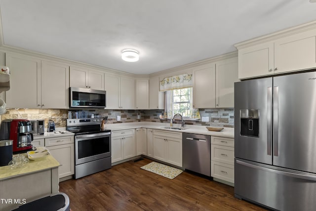 2004 Old Tusculum Rd, Greeneville, TN 37745 - kitchen featuring a sink, light countertops, decorative backsplash, and stainless steel appliances