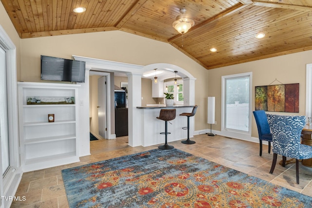 300 SW Grove Terrace Dr, Abingdon, VA 24210 - kitchen featuring wood ceiling, a breakfast bar area, decorative columns, stone tile flooring, and vaulted ceiling