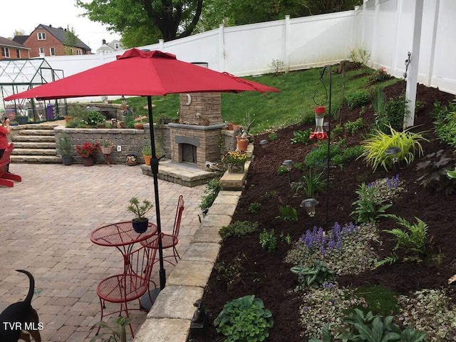 300 SW Grove Terrace Dr, Abingdon, VA 24210 - fenced backyard featuring an outdoor stone fireplace, a gazebo, and a patio