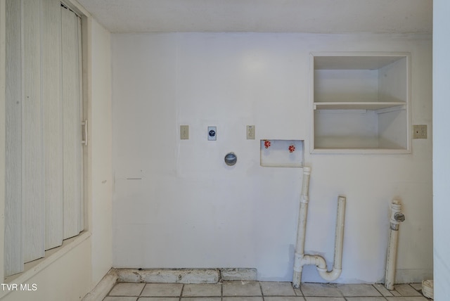 laundry room featuring tile patterned flooring, laundry area, electric dryer hookup, and hookup for a washing machine