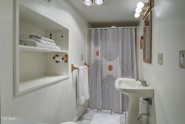 full bathroom with a sink, tile patterned floors, and a shower with curtain