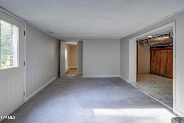 carpeted spare room with baseboards