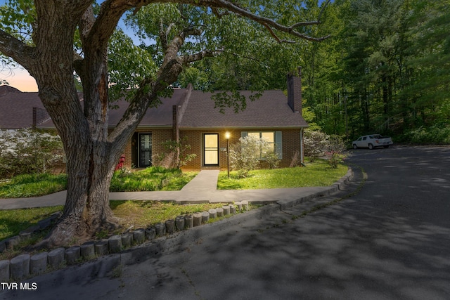 1837 Presswood Rd Unit 1837, Johnson City, TN 37604 - view of front of house featuring brick siding, a chimney, and a front lawn