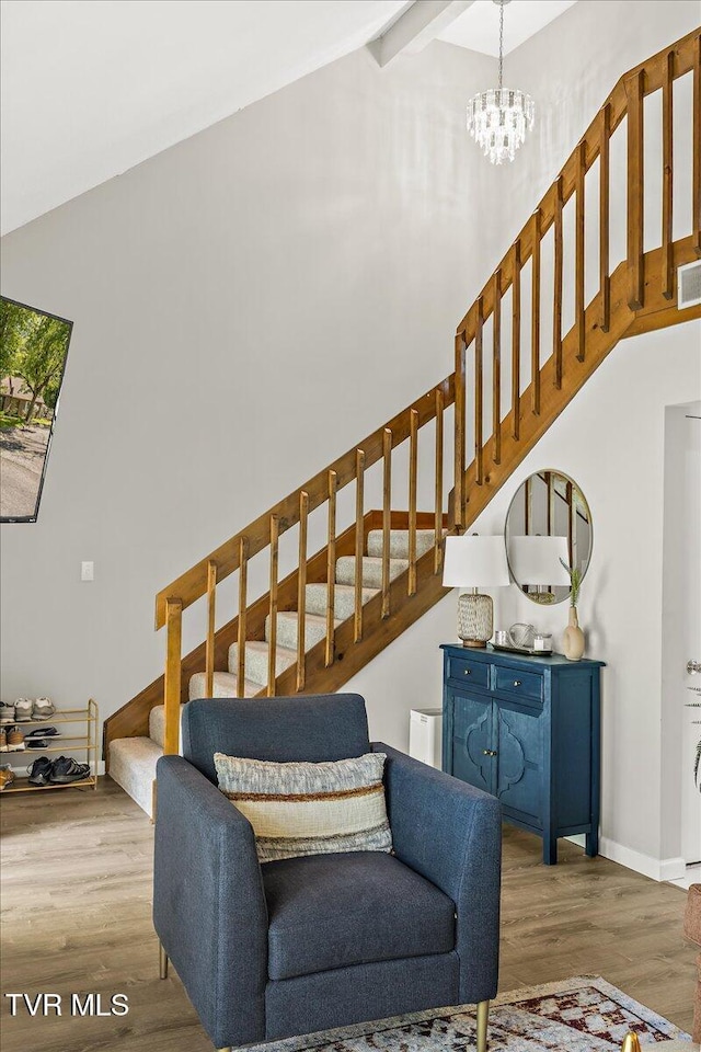 1837 Presswood Rd Unit 1837, Johnson City, TN 37604 - living room with an inviting chandelier, stairs, vaulted ceiling with beams, wood finished floors, and visible vents