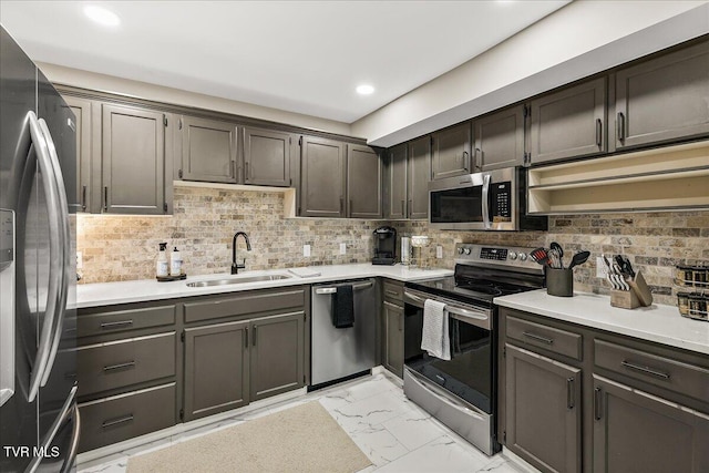 1837 Presswood Rd Unit 1837, Johnson City, TN 37604 - kitchen featuring decorative backsplash, a sink, light countertops, marble finish floor, and stainless steel appliances