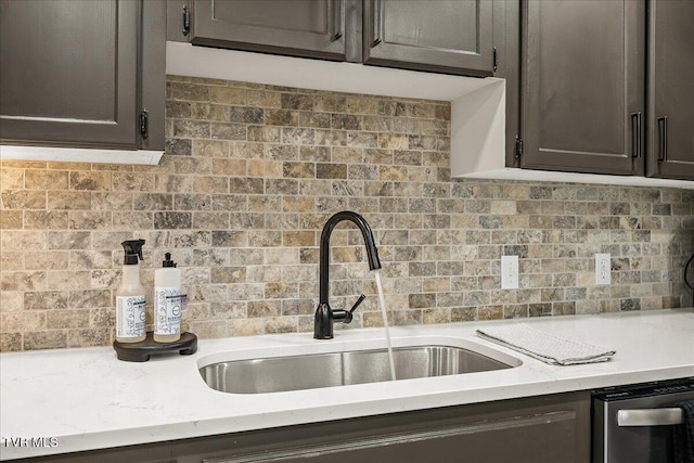 1837 Presswood Rd Unit 1837, Johnson City, TN 37604 - kitchen with decorative backsplash, dark brown cabinetry, a sink, light stone counters, and dishwashing machine