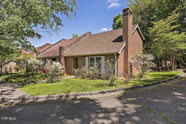 1837 Presswood Rd Unit 1837, Johnson City, TN 37604 - view of front of home featuring brick siding, a shingled roof, a front lawn, and a chimney