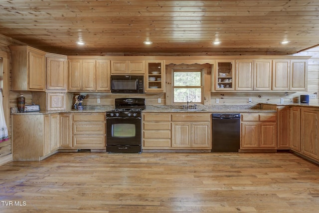 kitchen with a sink, light wood-style floors, light brown cabinets, wooden ceiling, and black appliances