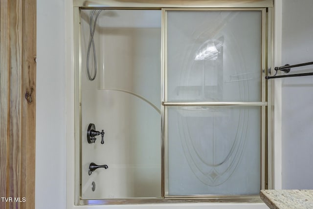 full bath featuring enclosed tub / shower combo