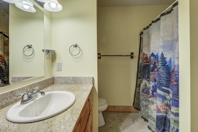bathroom with toilet, curtained shower, tile patterned flooring, and vanity