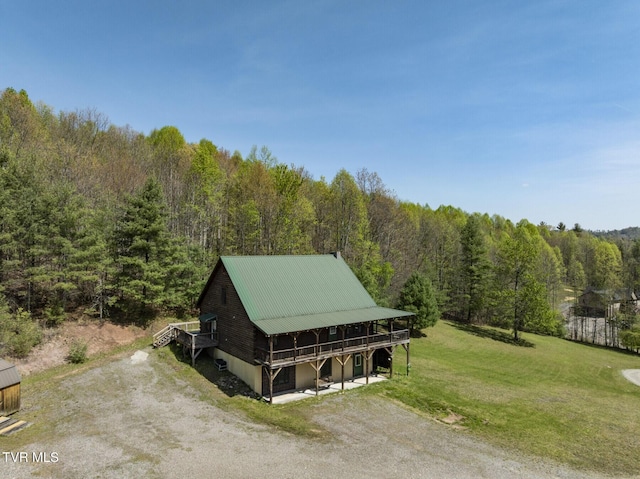 drone / aerial view featuring a view of trees