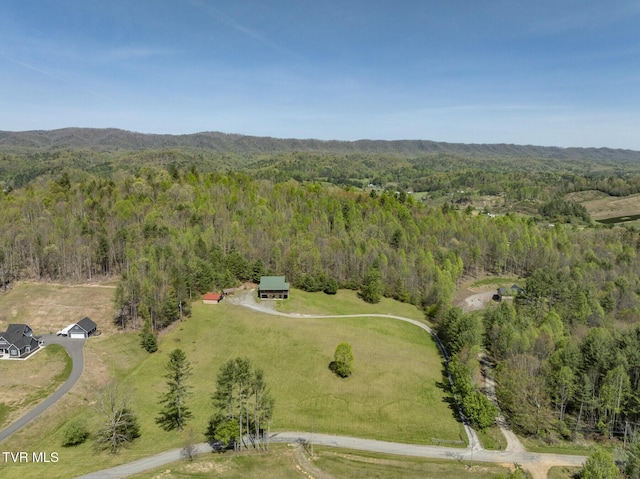 aerial view featuring a wooded view
