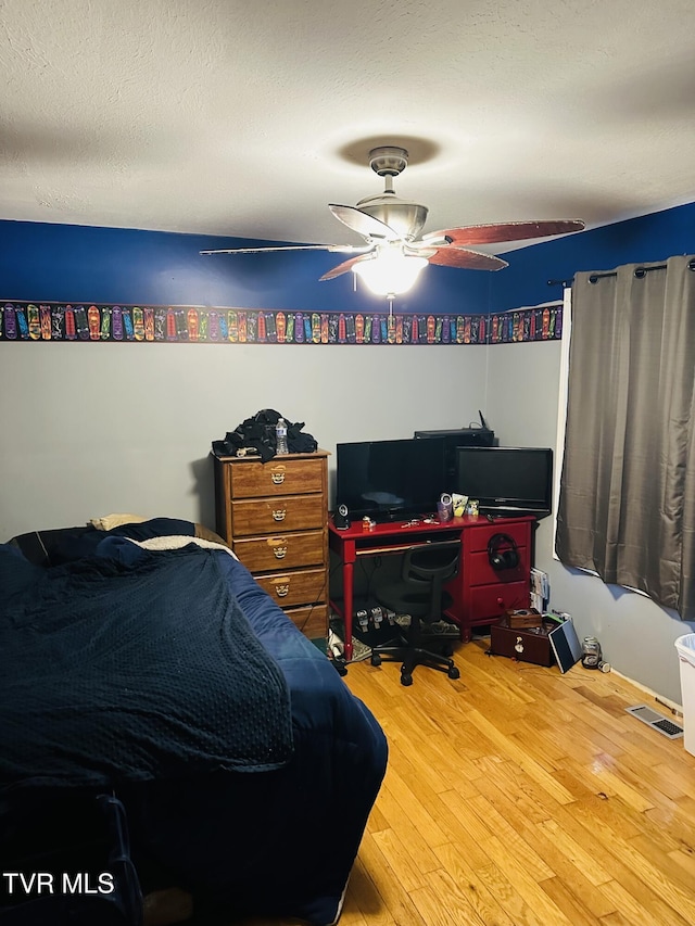 84 Deerview Ln, Lebanon, VA 24266 - bedroom with a ceiling fan, hardwood / wood-style floors, and visible vents