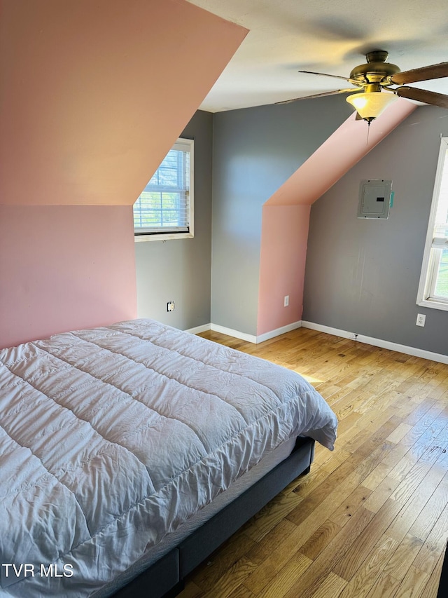 84 Deerview Ln, Lebanon, VA 24266 - bedroom with baseboards, multiple windows, wood-type flooring, and vaulted ceiling