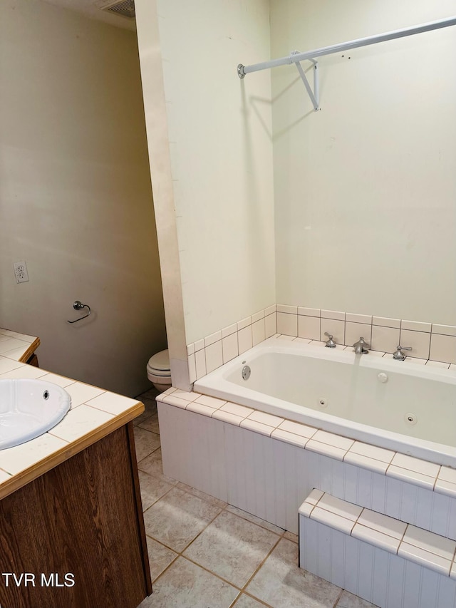 84 Deerview Ln, Lebanon, VA 24266 - full bathroom featuring vanity, toilet, tile patterned flooring, and a whirlpool tub