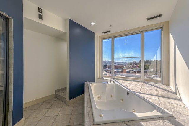 200 E Main St Unit 5, Johnson City, TN 37604 - bathroom with visible vents, tile patterned flooring, a whirlpool tub, and baseboards