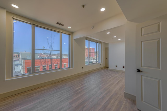 200 E Main St Unit 5, Johnson City, TN 37604 - empty room featuring baseboards, recessed lighting, wood finished floors, and visible vents