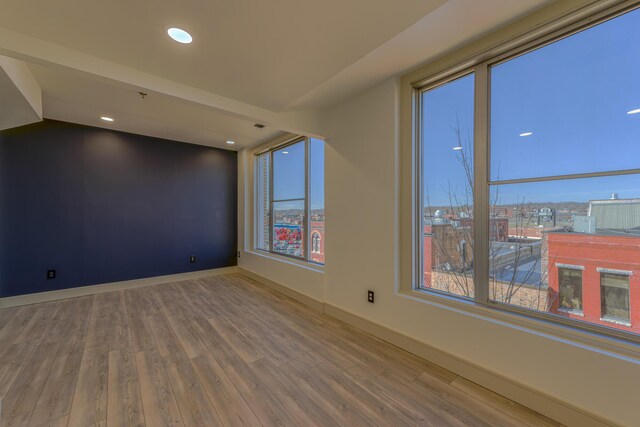 200 E Main St Unit 5, Johnson City, TN 37604 - empty room featuring baseboards, recessed lighting, and wood finished floors