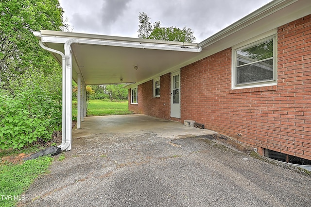 exterior space featuring driveway and a carport