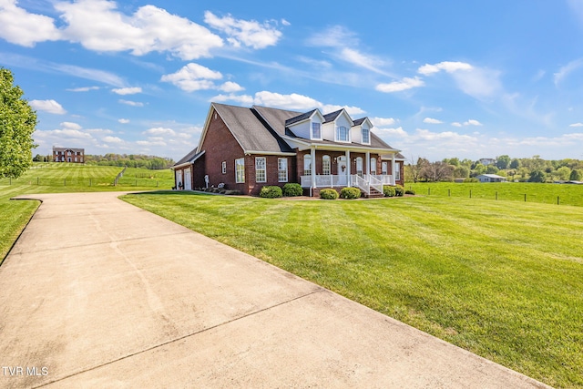 963 Beaver Creek Rd, Bluff City, TN 37618 - view of front facade featuring a front lawn, fence, brick siding, a porch, and driveway
