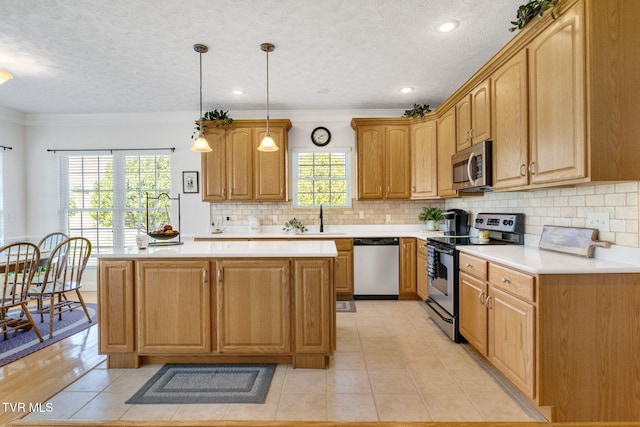 963 Beaver Creek Rd, Bluff City, TN 37618 - kitchen with light countertops, a textured ceiling, appliances with stainless steel finishes, and backsplash