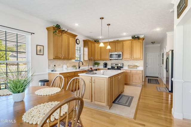 963 Beaver Creek Rd, Bluff City, TN 37618 - kitchen with light countertops, appliances with stainless steel finishes, a sink, and tasteful backsplash