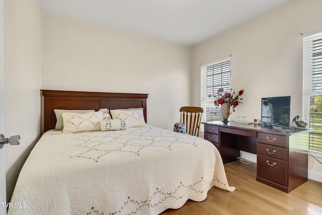 963 Beaver Creek Rd, Bluff City, TN 37618 - bedroom featuring baseboards and light wood-style floors