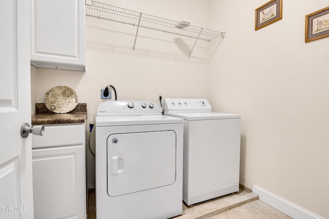 963 Beaver Creek Rd, Bluff City, TN 37618 - laundry room featuring baseboards, cabinet space, light tile patterned flooring, and independent washer and dryer