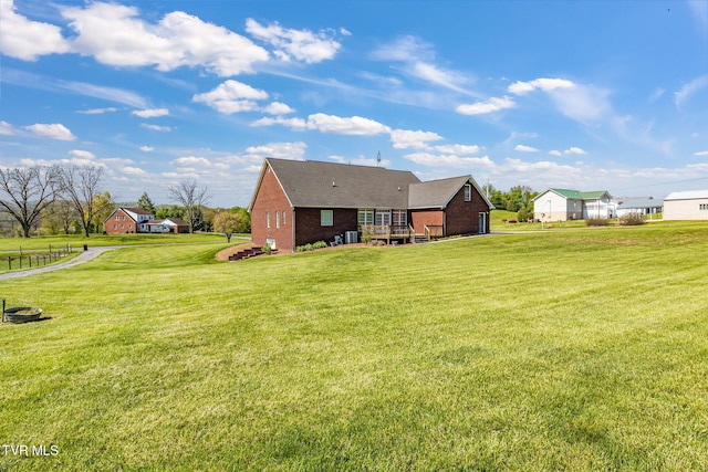963 Beaver Creek Rd, Bluff City, TN 37618 - back of property with brick siding, a wooden deck, and a yard