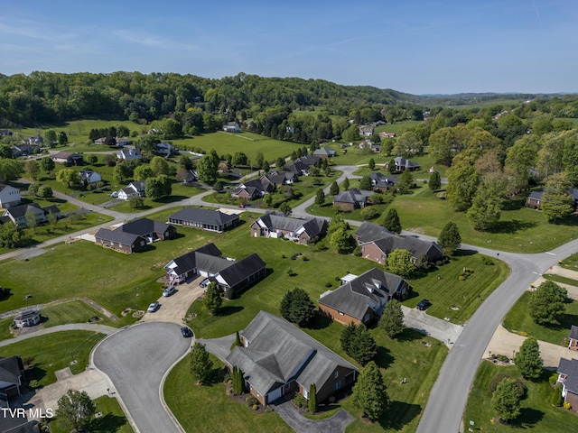 birds eye view of property with a residential view