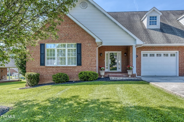 view of front facade featuring driveway, roof with shingles, a garage, brick siding, and a front lawn