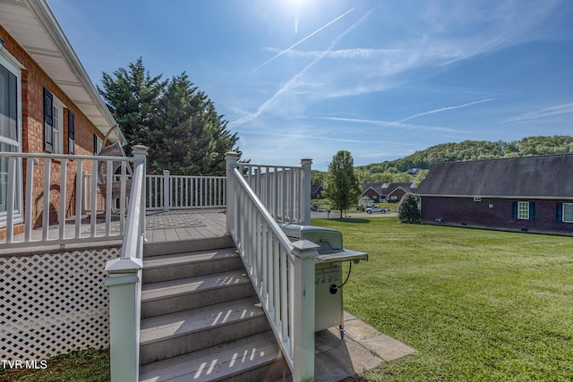 view of yard featuring stairs and a deck