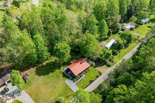 drone / aerial view featuring a view of trees