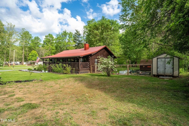 view of yard featuring an outbuilding and a storage shed