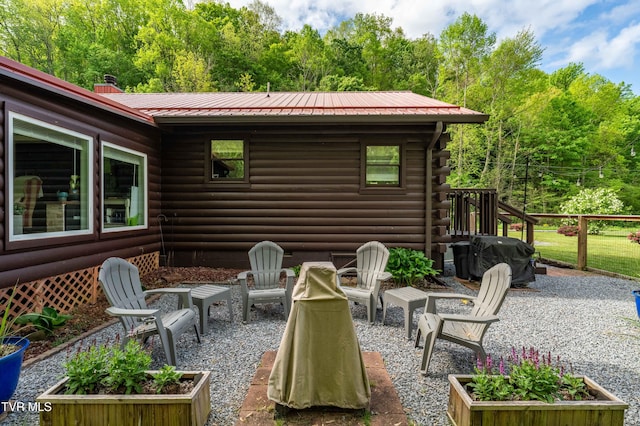 view of patio / terrace featuring grilling area and a fire pit