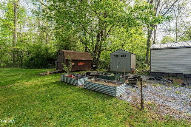 view of yard featuring a storage shed, an outbuilding, and a garden