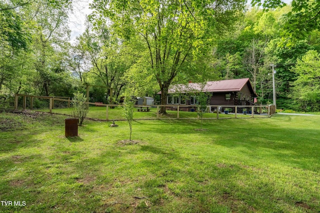 view of yard with a wooden deck