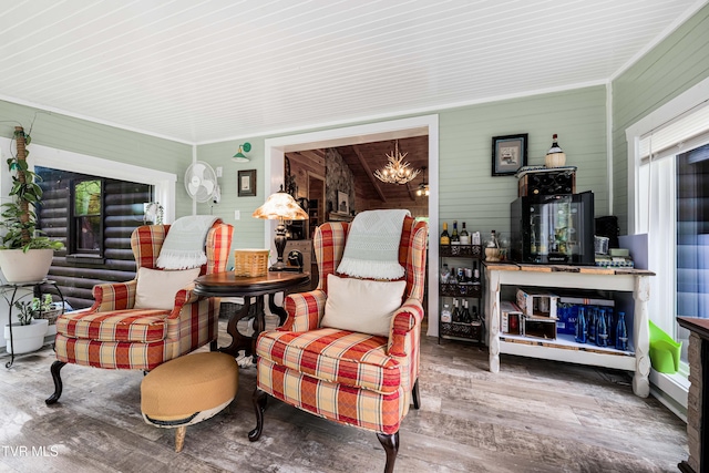 interior space featuring wood finished floors and a chandelier
