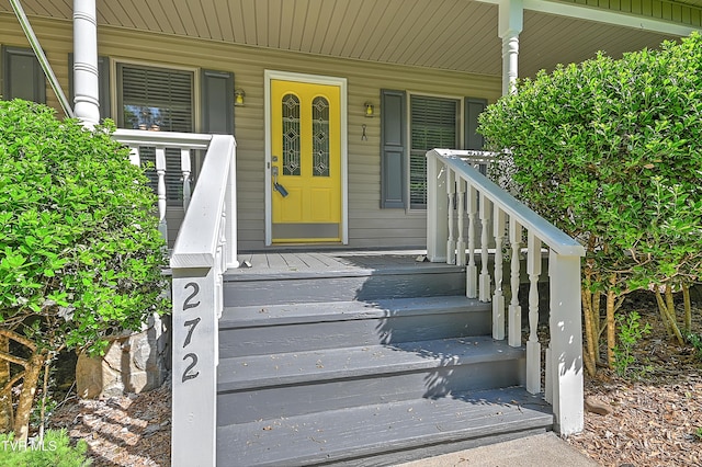 doorway to property with covered porch