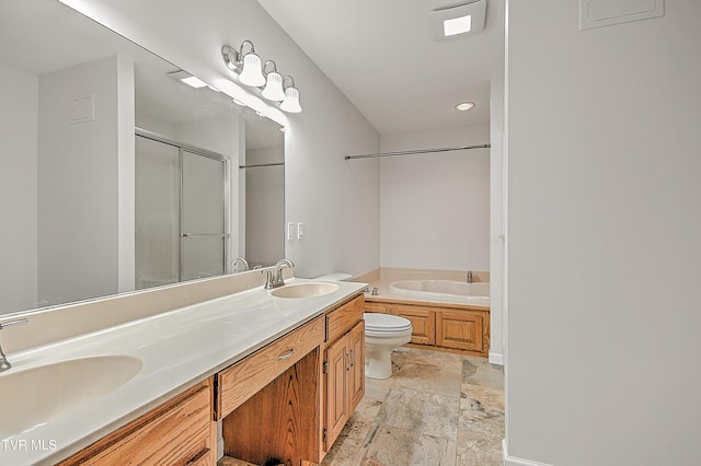 bathroom with a sink, stone finish flooring, a bath, and a shower with door