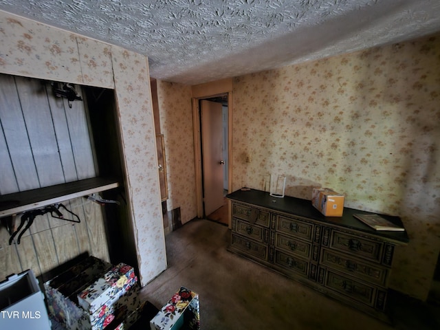 7231 Rocky Fork Rd, Wise, VA 24293 - unfurnished bedroom with wallpapered walls and a textured ceiling