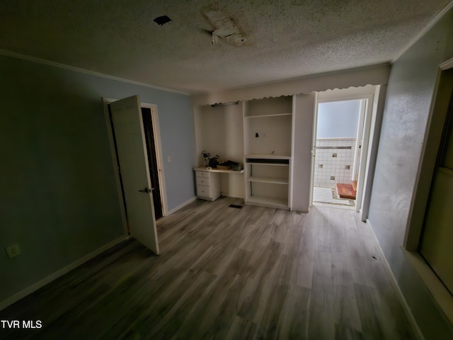 7231 Rocky Fork Rd, Wise, VA 24293 - unfurnished living room featuring a textured ceiling, wood finished floors, and crown molding