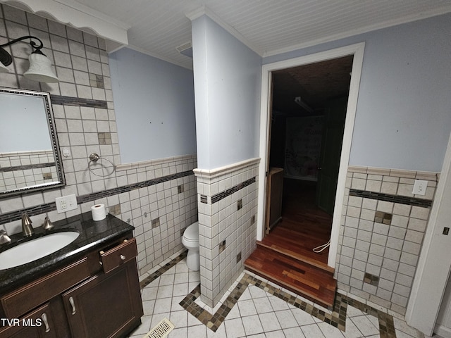 7231 Rocky Fork Rd, Wise, VA 24293 - bathroom featuring tile walls, tile patterned floors, vanity, crown molding, and a wainscoted wall