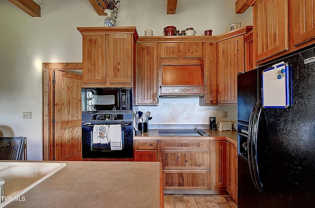 kitchen with premium range hood, black appliances, brown cabinets, and beam ceiling
