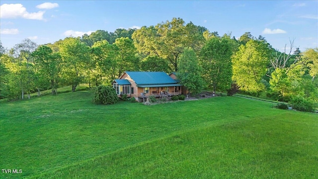 view of yard with a view of trees