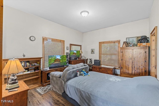 bedroom featuring wood finished floors