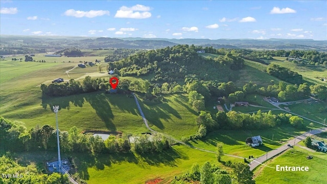 birds eye view of property with a rural view